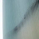 Pale blue vertical fins repeating across a building facade